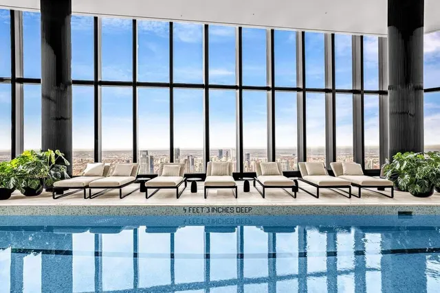 a view of swimming pool with seating area