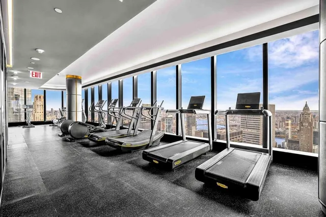 a view of swimming pool with outdoor seating