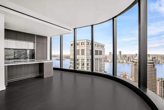 a view of a room with window and wooden floor