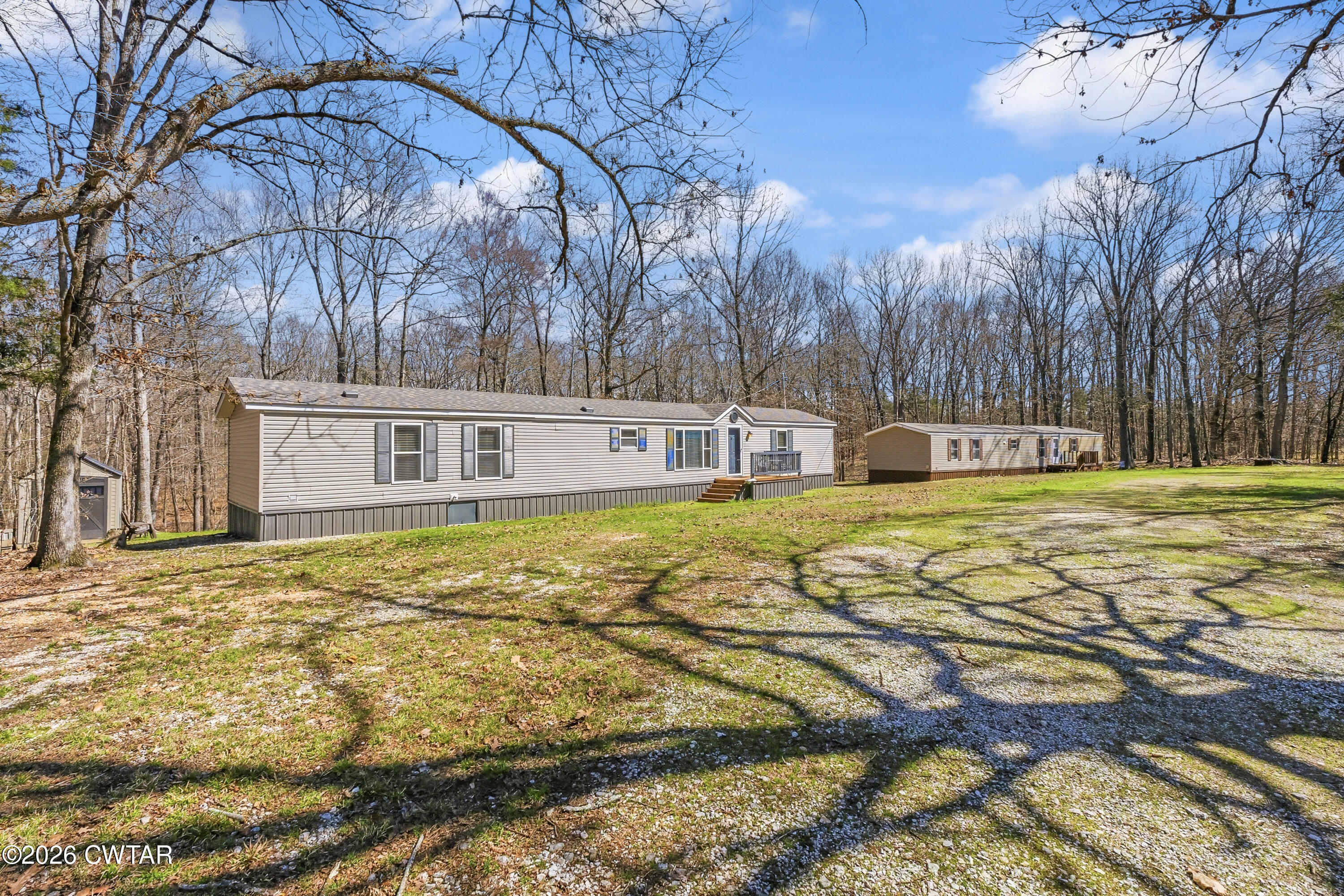 a swimming pool with trees in the background