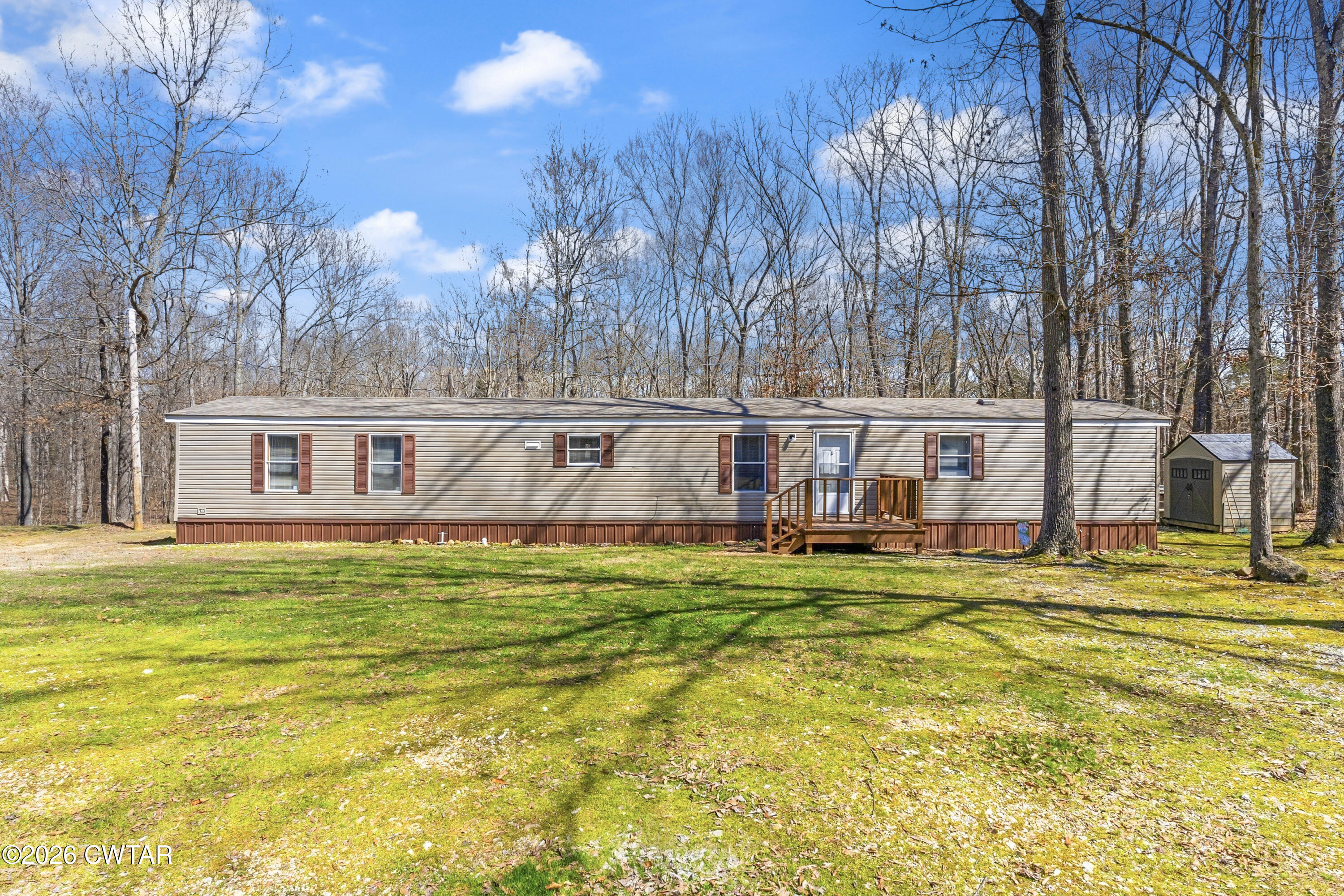 1444-1448 New Hope Road Big Sandy, TN 38221 - Photo 20 of 39 a view of a house with pool and sitting area