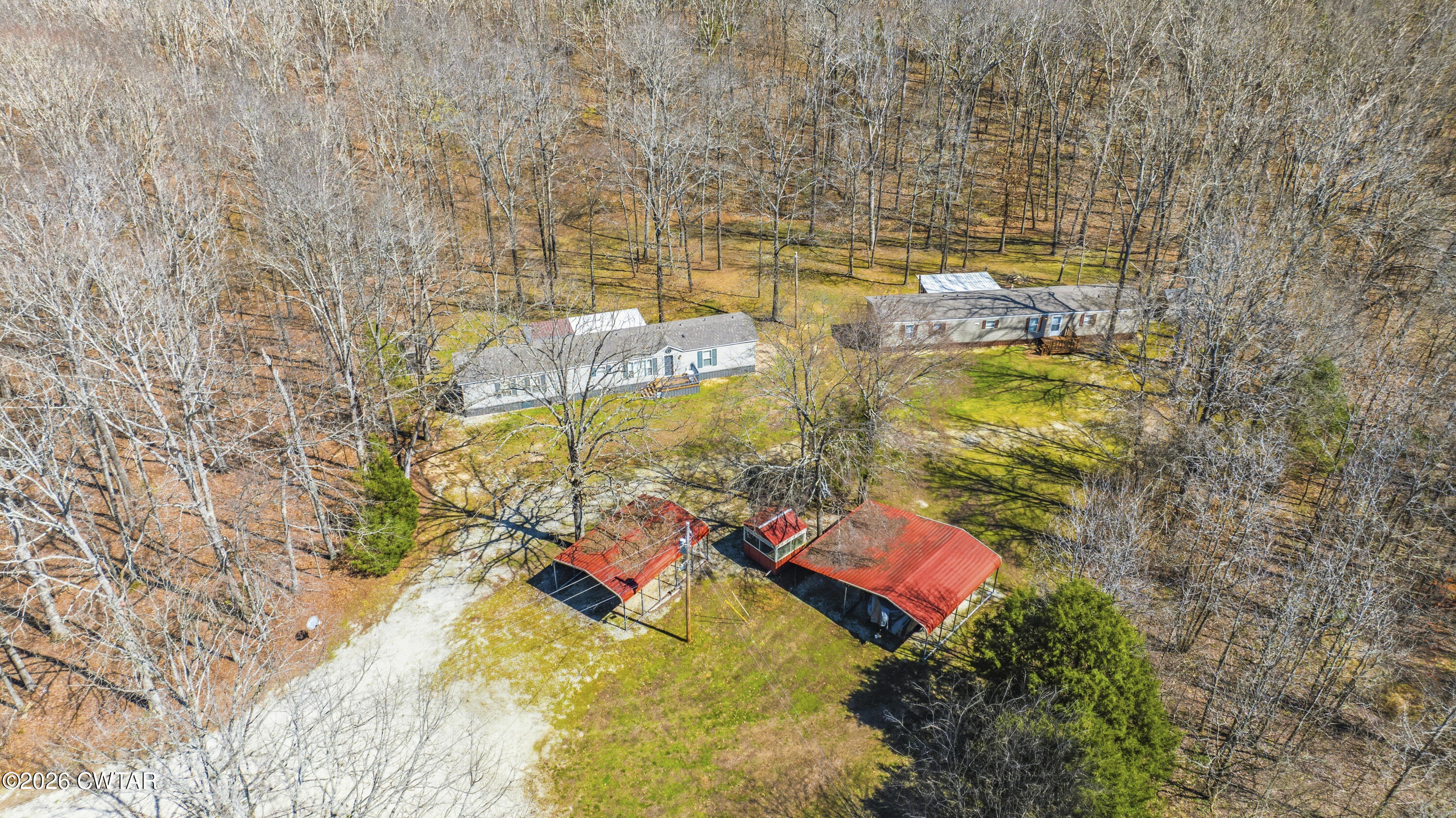 1444-1448 New Hope Road Big Sandy, TN 38221 - Photo 2 of 39 a view of walk in a yard