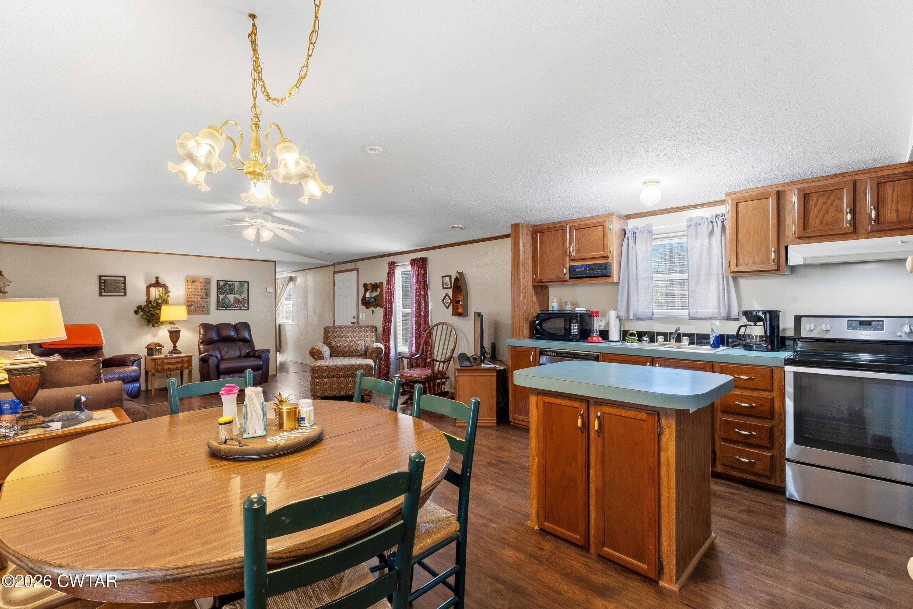 1444-1448 New Hope Road Big Sandy, TN 38221 - Photo 25 of 39 a view of a dining room with furniture window and wooden floor