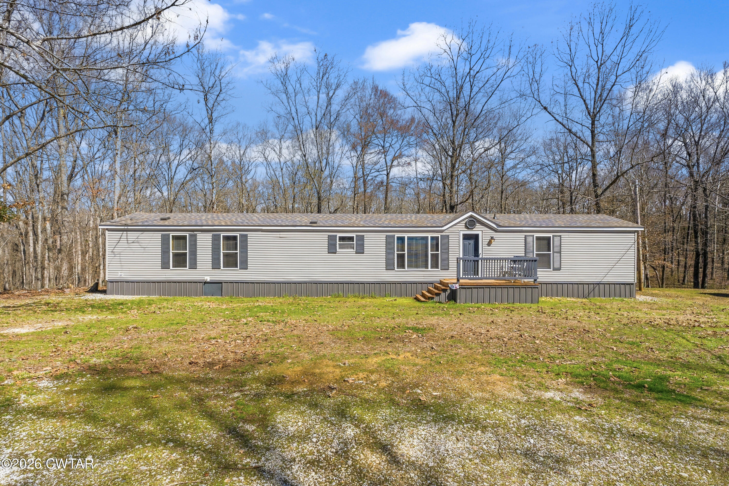 1444-1448 New Hope Road Big Sandy, TN 38221 - Photo 4 of 39 a front view of a house with swimming pool