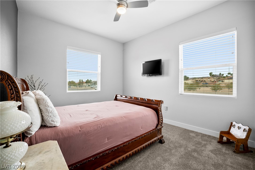 432 North Racetrack Road Henderson, NV 89015 - Photo 12 of 45 Carpeted bedroom with baseboards and ceiling fan