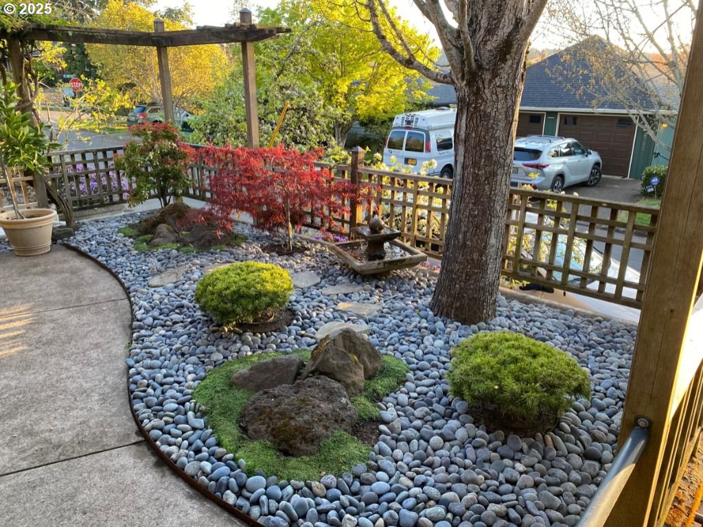 2775 Elinor Street Eugene, OR 97403 - Photo 35 of 48 a view of a garden with a bench in patio