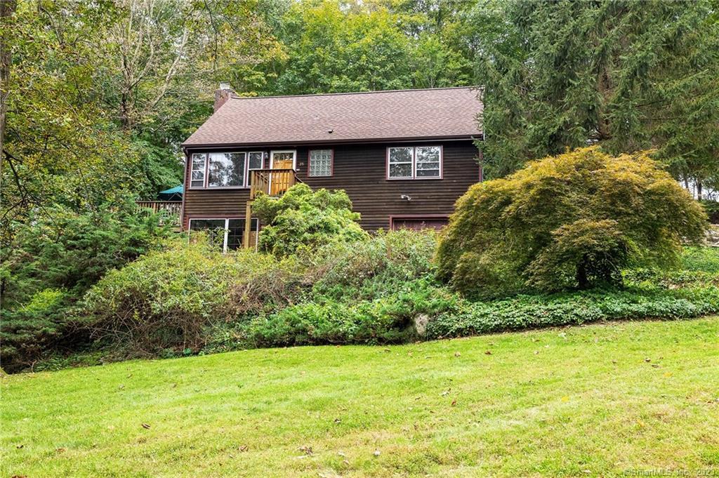 25 Split Level Road Ridgefield, CT 06877 - Photo 1 of 1 a view of a house with a yard plants and large tree