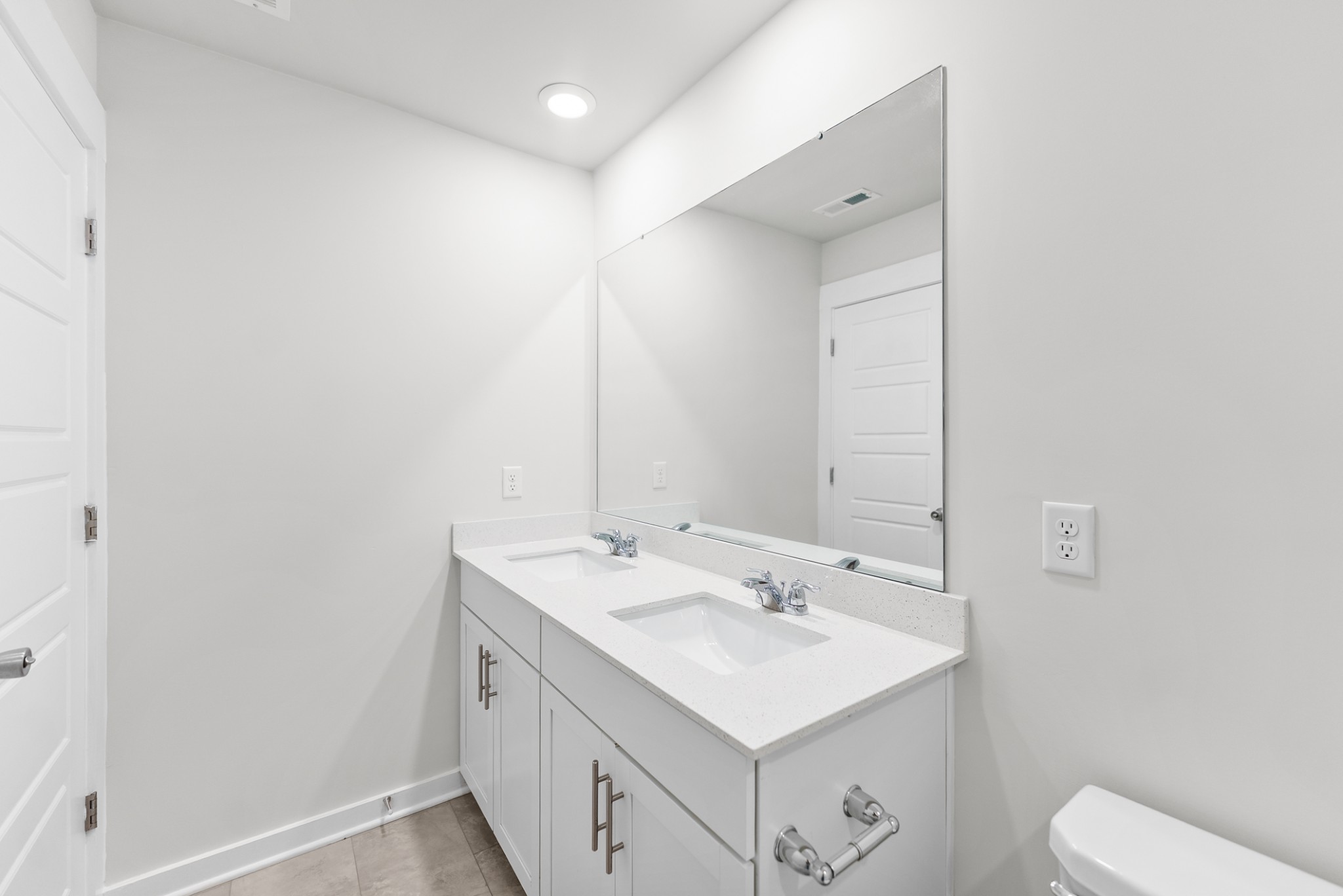 1255 Inverness Pass Lebanon, TN 37087 - Photo 34 of 40 a bathroom with a sink a toilet and a mirror