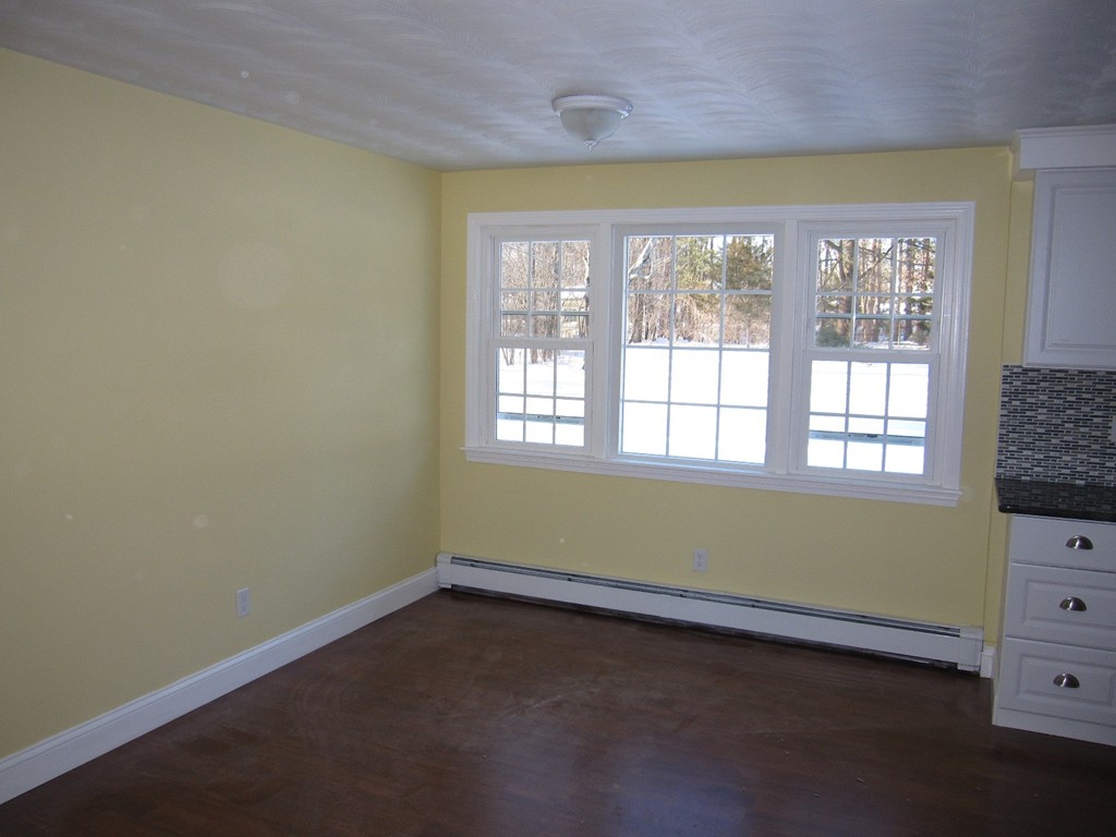 16 Cornell Road Framingham, MA 01701 - Photo 5 of 17 an empty room with a window and a dresser
