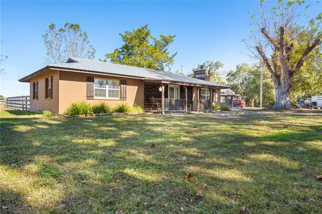 a view of a porch with wooden floor