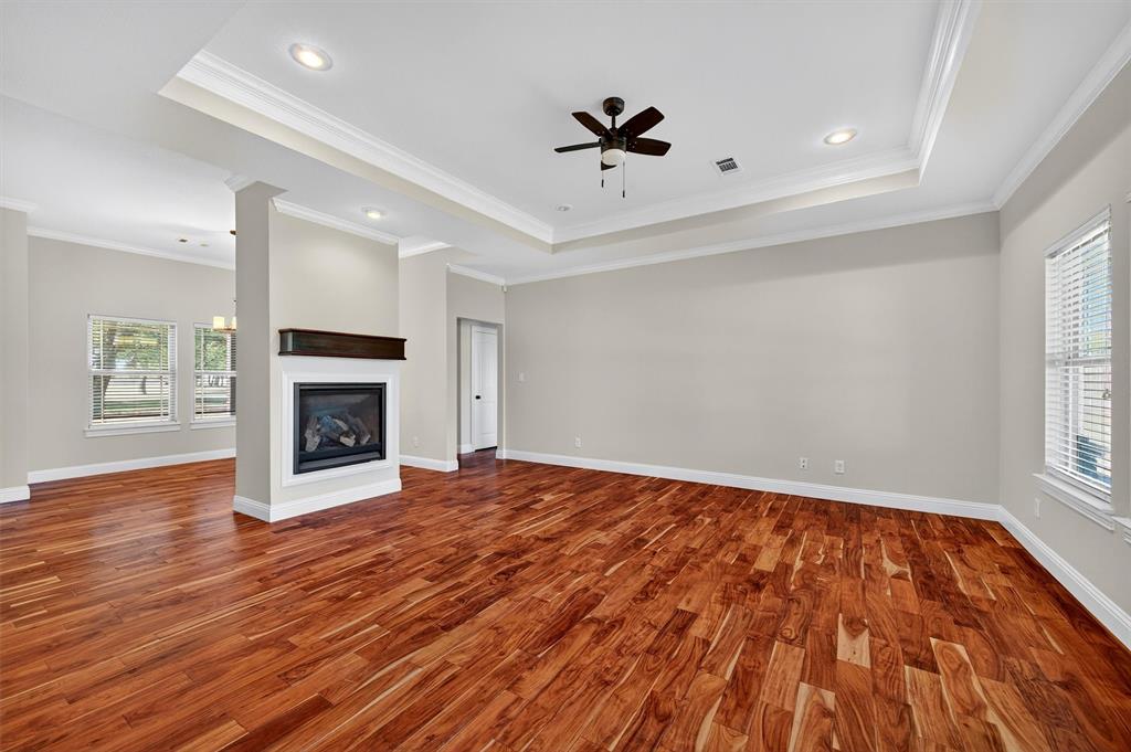 357 Pear Tree Lane Collinsville, TX 76233 - Photo 12 of 37 a view of empty room with wooden floor and fireplace