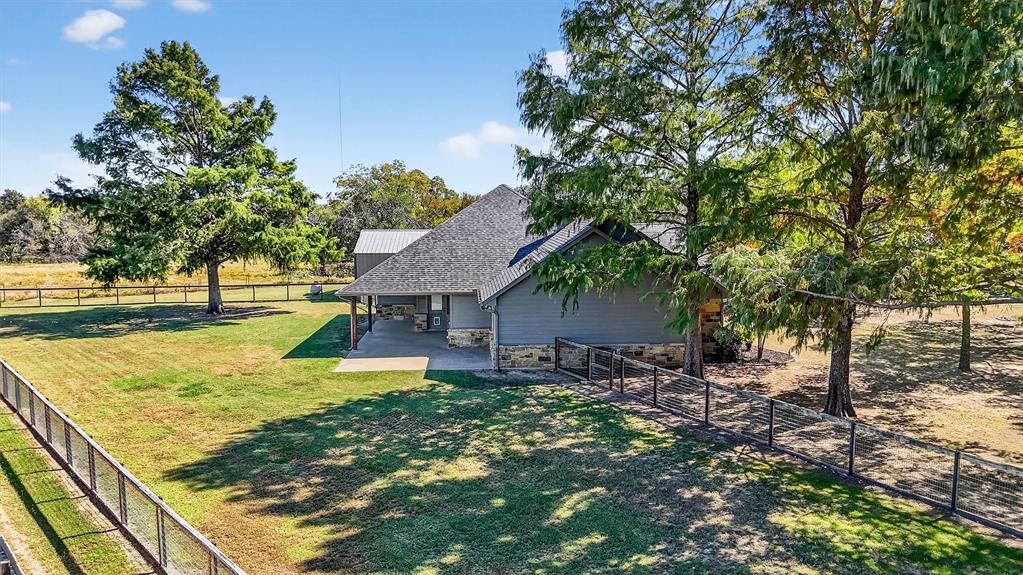 357 Pear Tree Lane Collinsville, TX 76233 - Photo 2 of 37 a view of a house with pool and sitting area