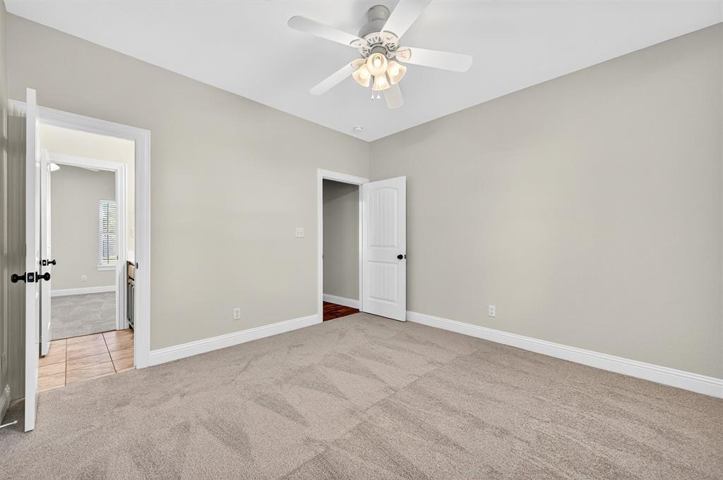 357 Pear Tree Lane Collinsville, TX 76233 - Photo 26 of 37 a view of an empty room with a ceiling fan