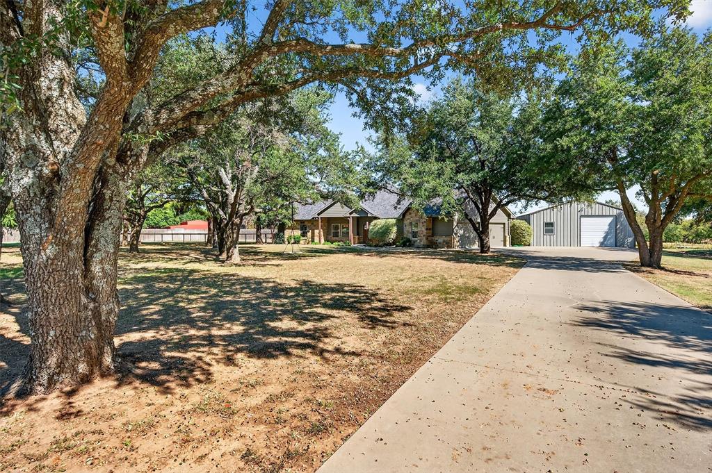 357 Pear Tree Lane Collinsville, TX 76233 - Photo 3 of 37 a view of road with trees