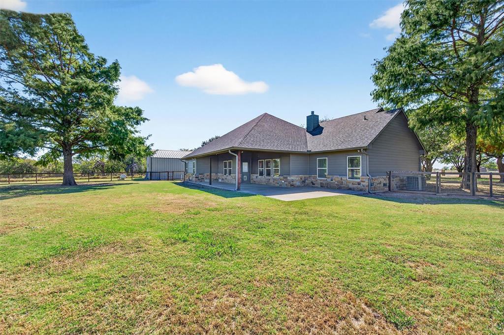 357 Pear Tree Lane Collinsville, TX 76233 - Photo 31 of 37 a front view of a house with swimming pool and deck
