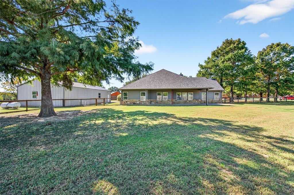 357 Pear Tree Lane Collinsville, TX 76233 - Photo 33 of 37 a view of house with garden space and sitting area