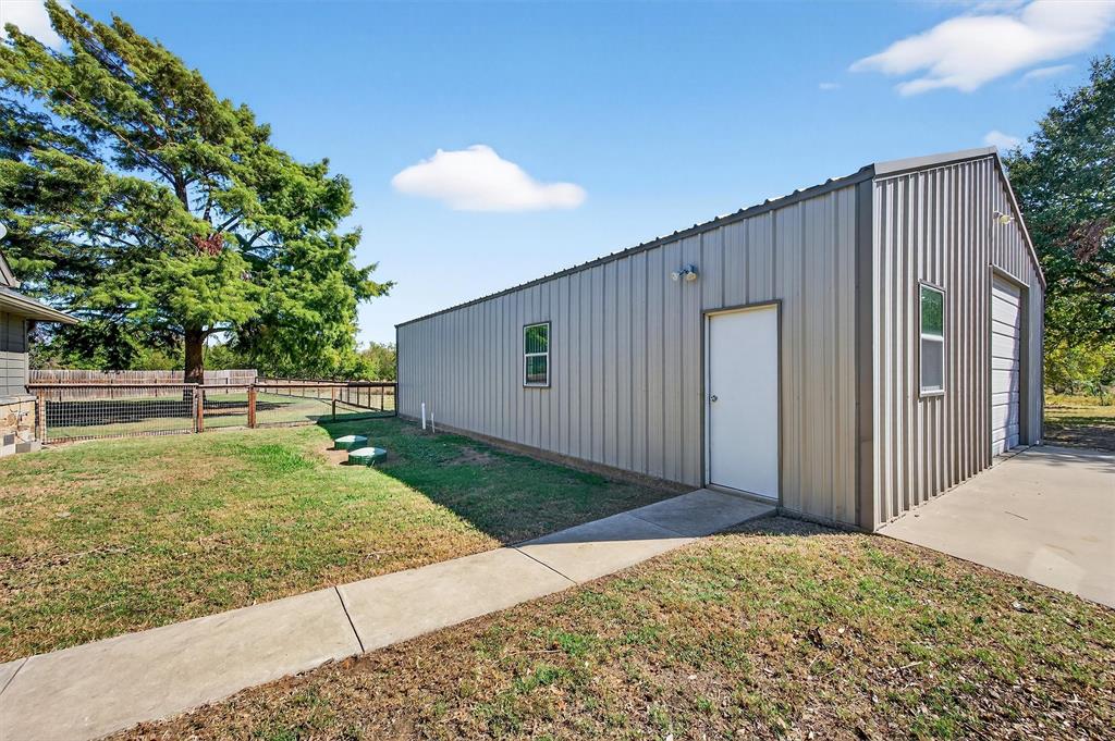 357 Pear Tree Lane Collinsville, TX 76233 - Photo 34 of 37 a view of a backyard with large trees