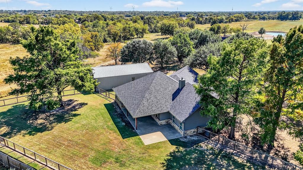357 Pear Tree Lane Collinsville, TX 76233 - Photo 5 of 37 an aerial view of a house with a yard and lake view