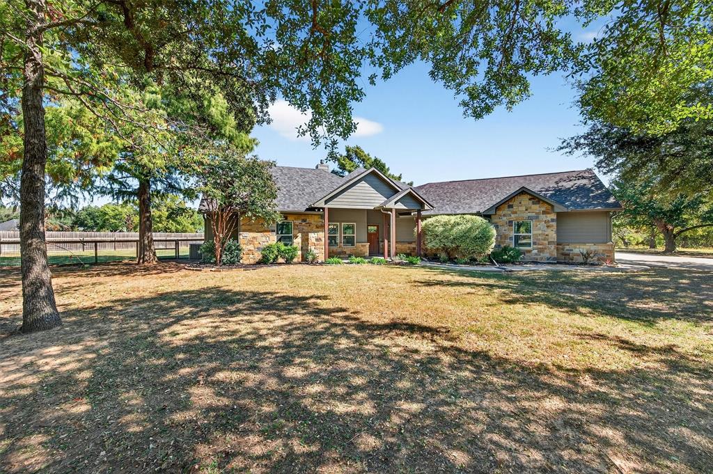 357 Pear Tree Lane Collinsville, TX 76233 - Photo 8 of 37 a front view of a house with a yard