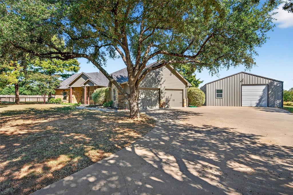 357 Pear Tree Lane Collinsville, TX 76233 - Photo 10 of 37 a house with yard tree in front of it