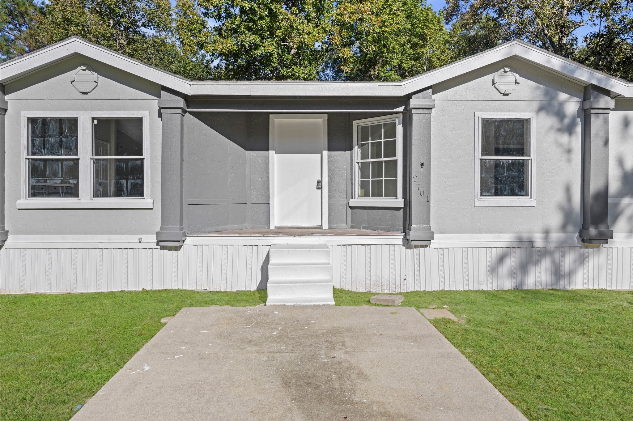 Spacious walkway that provides a welcoming path to the front door.