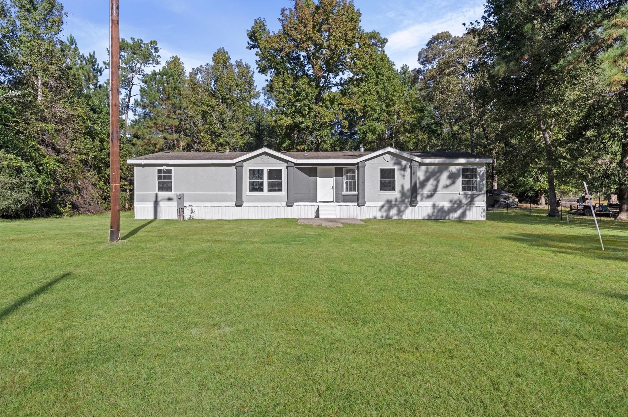 2701 Farm To Market 1127 Shepherd, TX 77371 - Photo 1 of 30 a front view of a house with a garden and trees