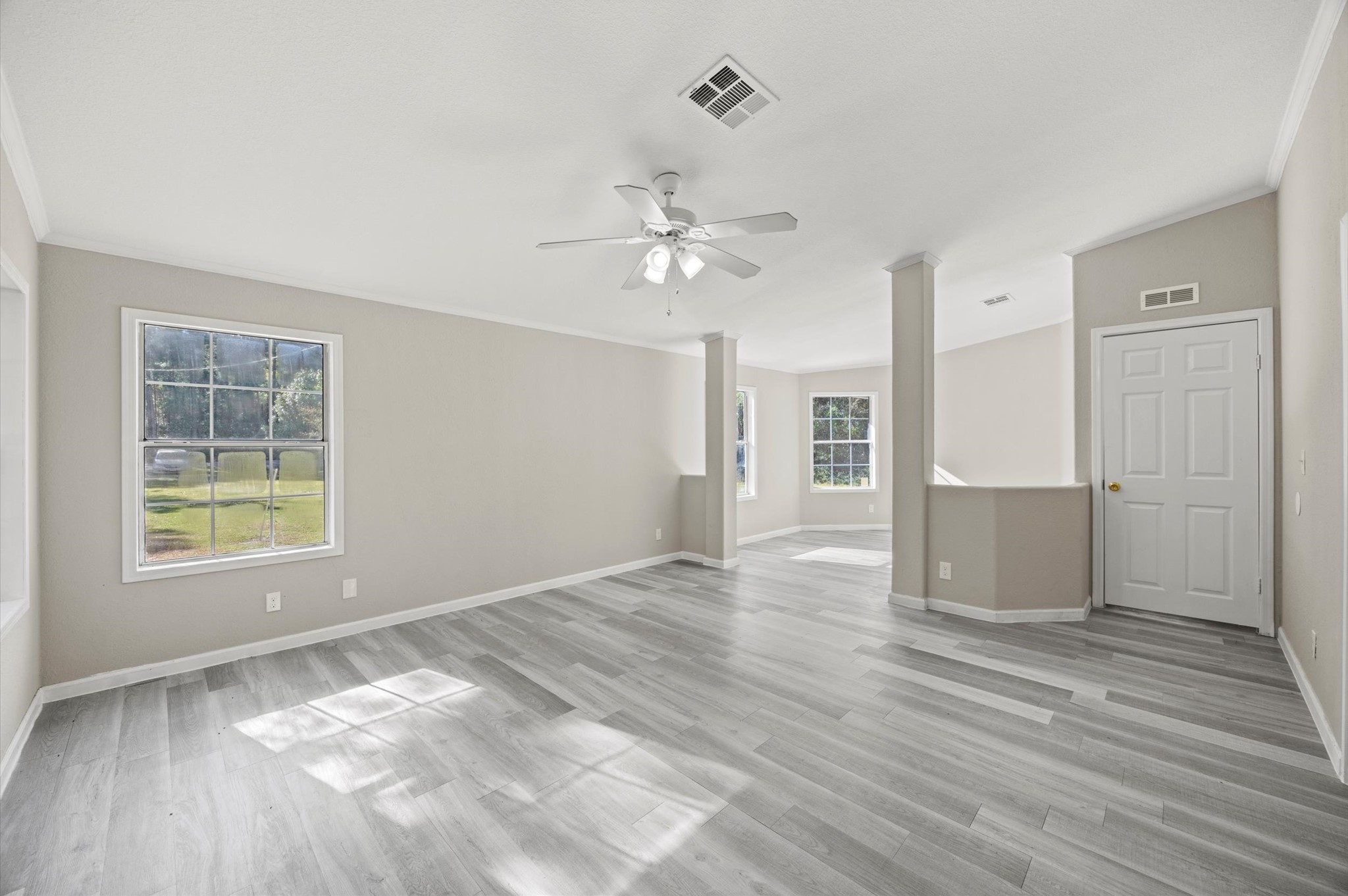 2701 Farm To Market 1127 Shepherd, TX 77371 - Photo 11 of 30 wooden floor in an empty room with a window