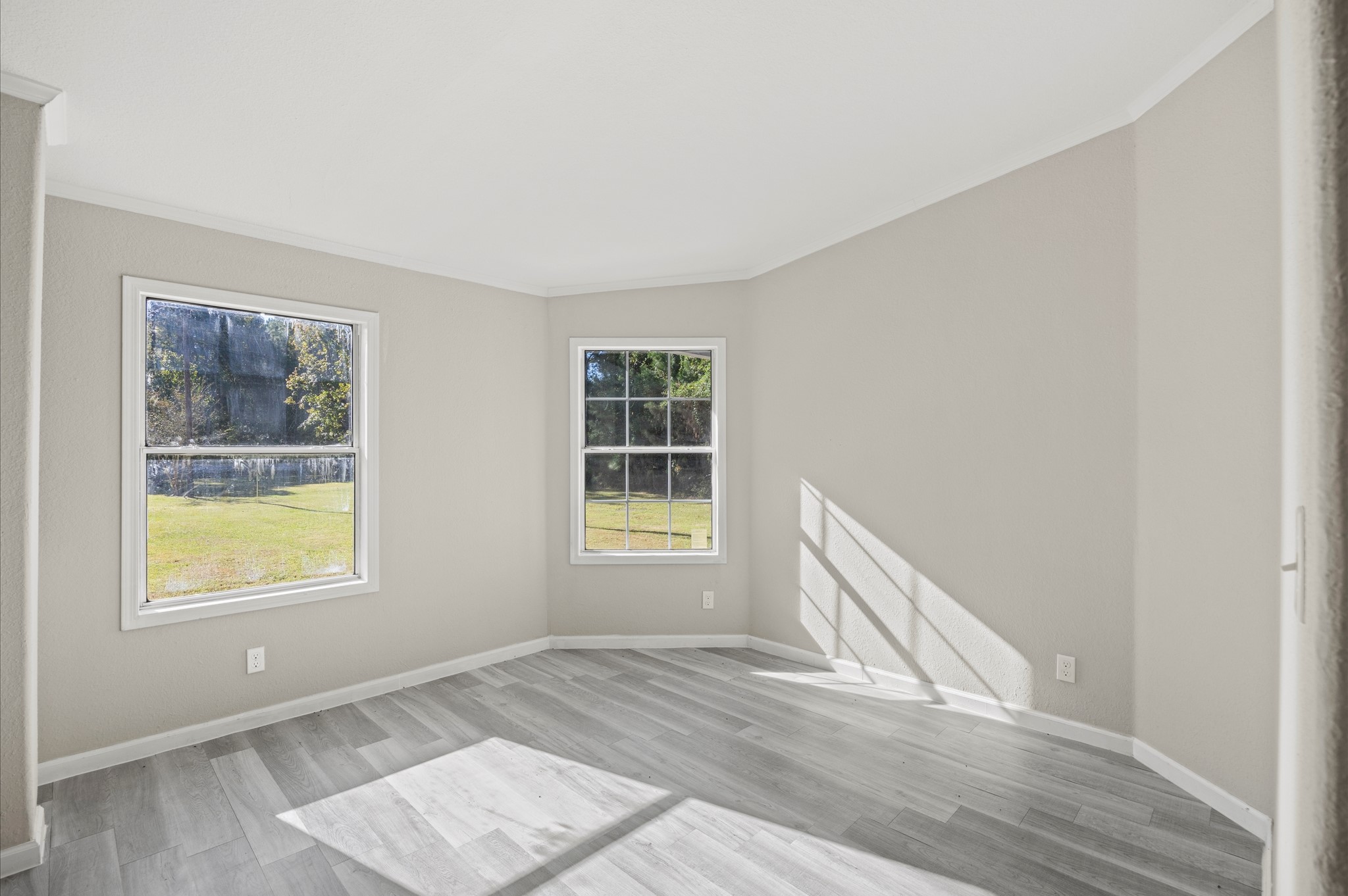 2701 Farm To Market 1127 Shepherd, TX 77371 - Photo 12 of 30 a view of an empty room with wooden floor and a window