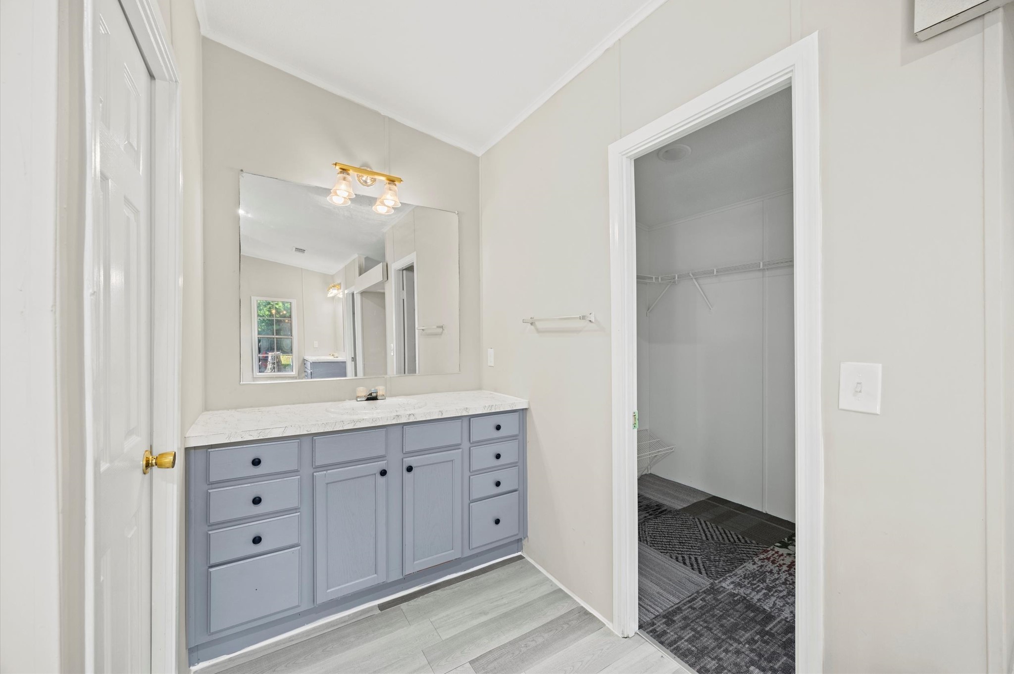 2701 Farm To Market 1127 Shepherd, TX 77371 - Photo 15 of 30 a spacious bathroom with a granite countertop sink mirror and