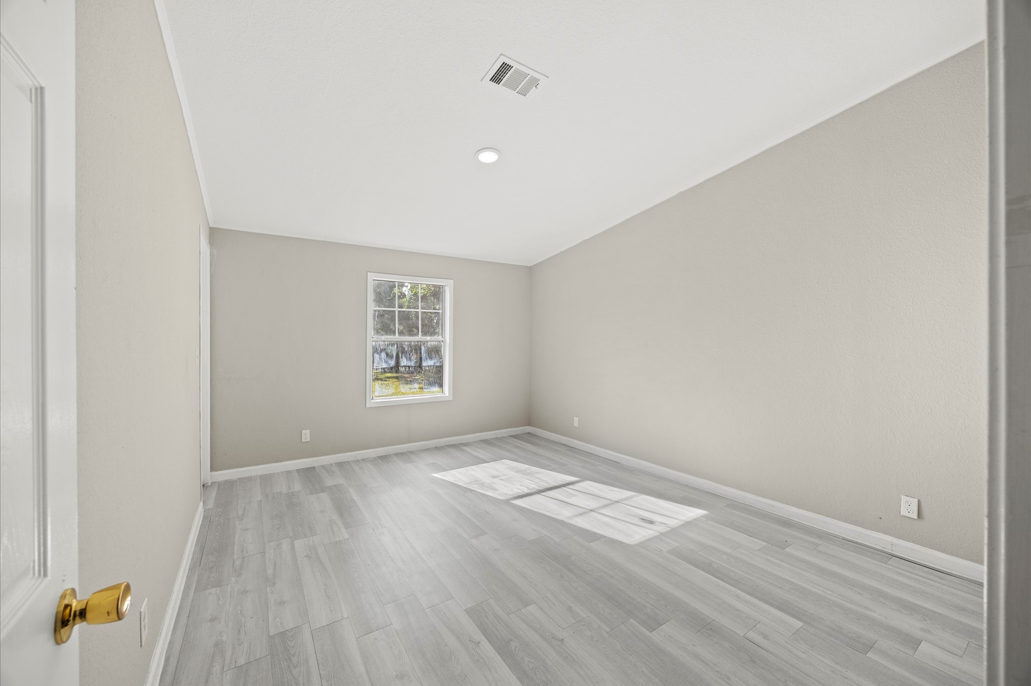 2701 Farm To Market 1127 Shepherd, TX 77371 - Photo 18 of 30 an empty room with wooden floor and windows