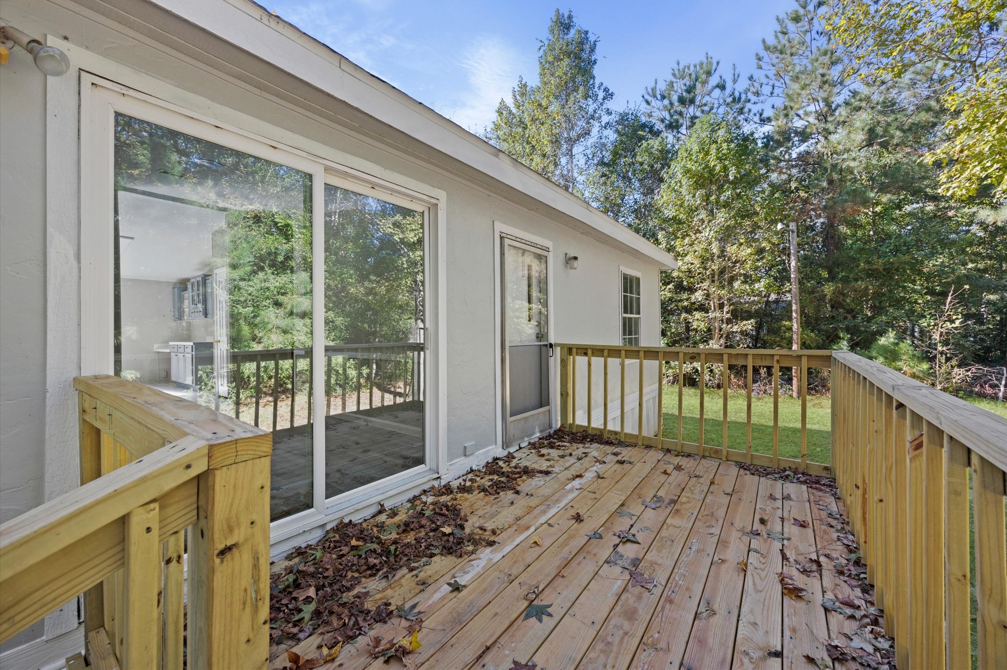 2701 Farm To Market 1127 Shepherd, TX 77371 - Photo 22 of 30 a view of balcony with wooden floor and fence