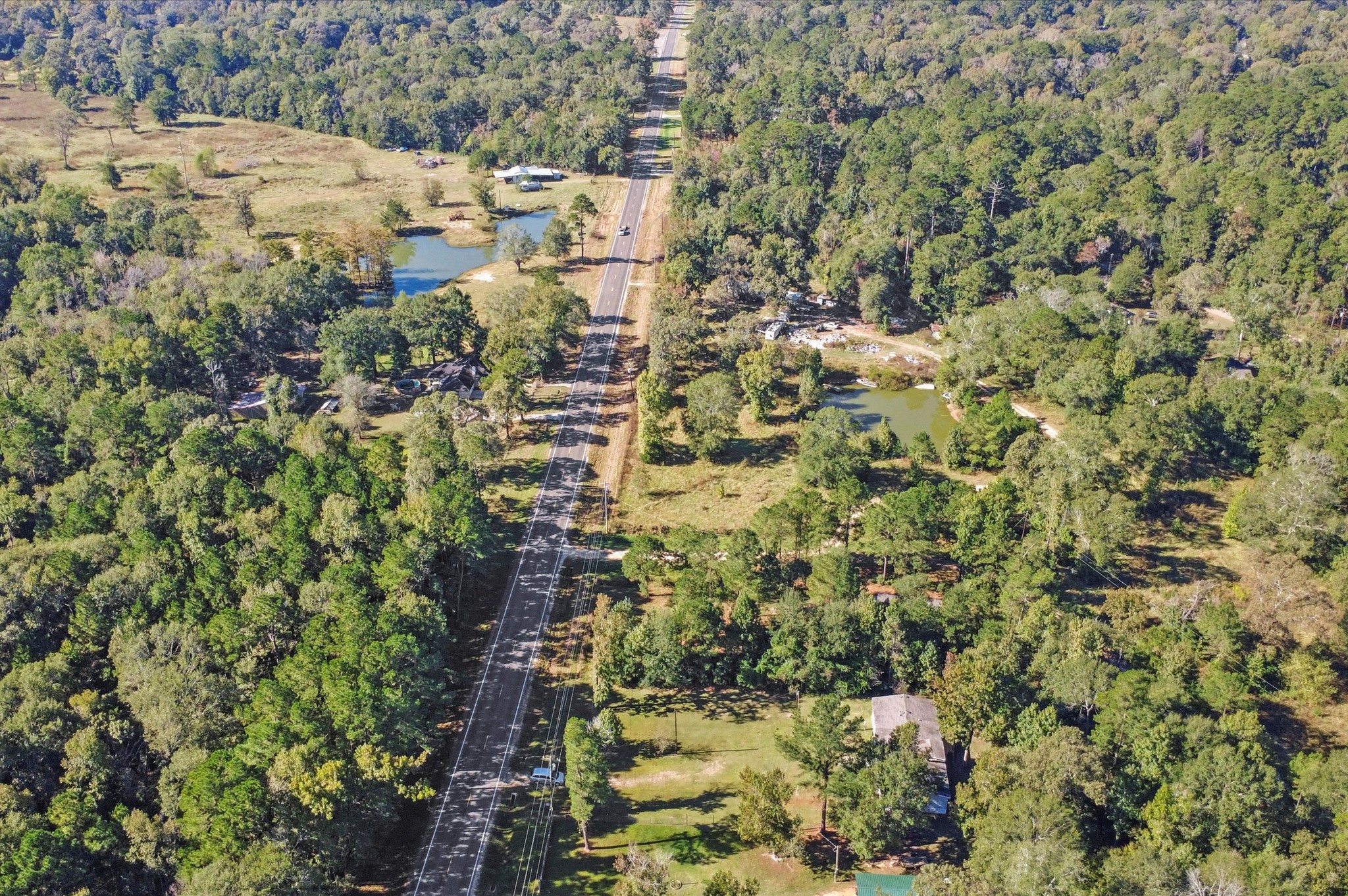 2701 Farm To Market 1127 Shepherd, TX 77371 - Photo 26 of 30 an aerial view of residential house with parking space