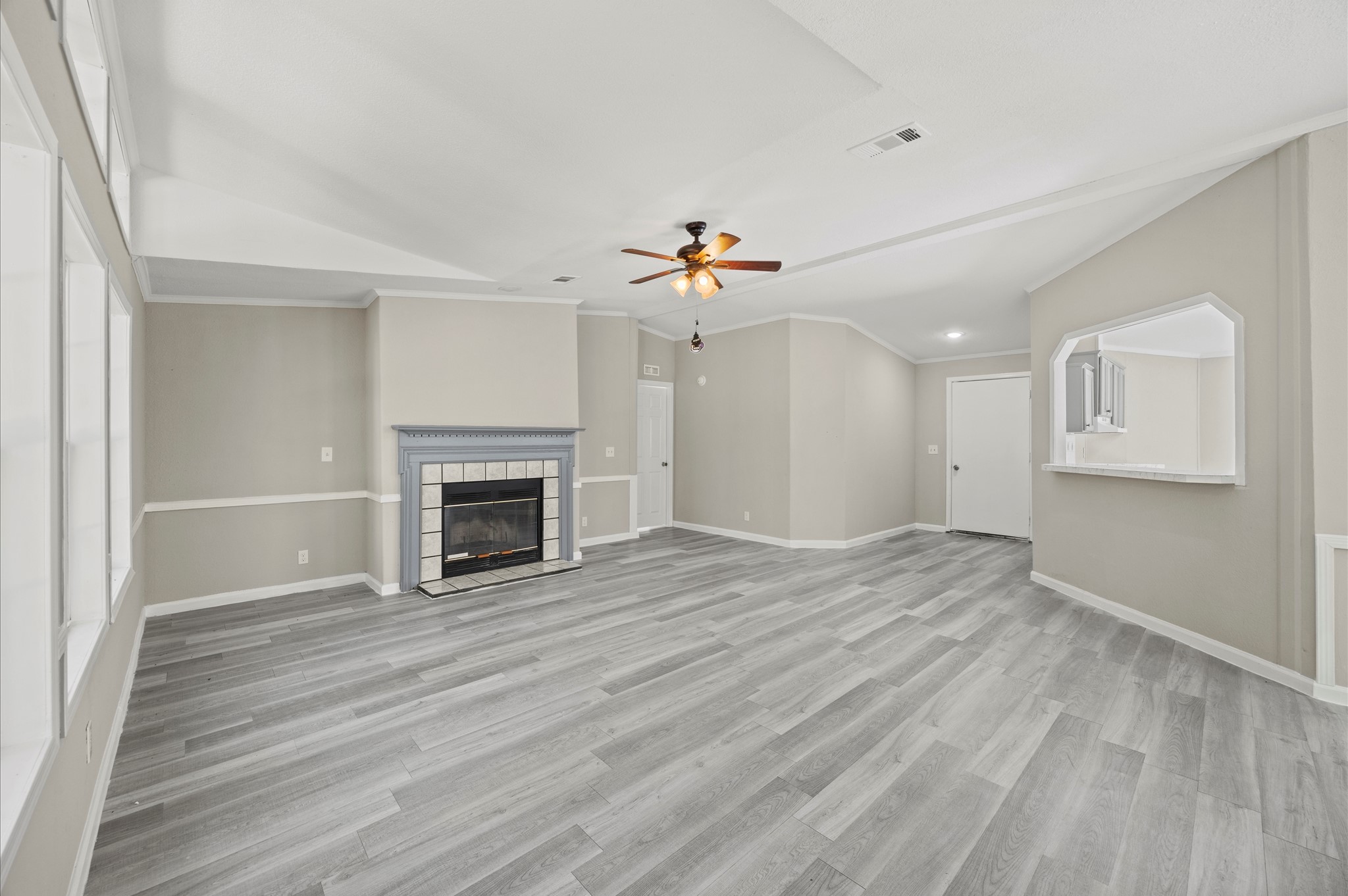 2701 Farm To Market 1127 Shepherd, TX 77371 - Photo 4 of 30 a view of an empty room with a fireplace and a window
