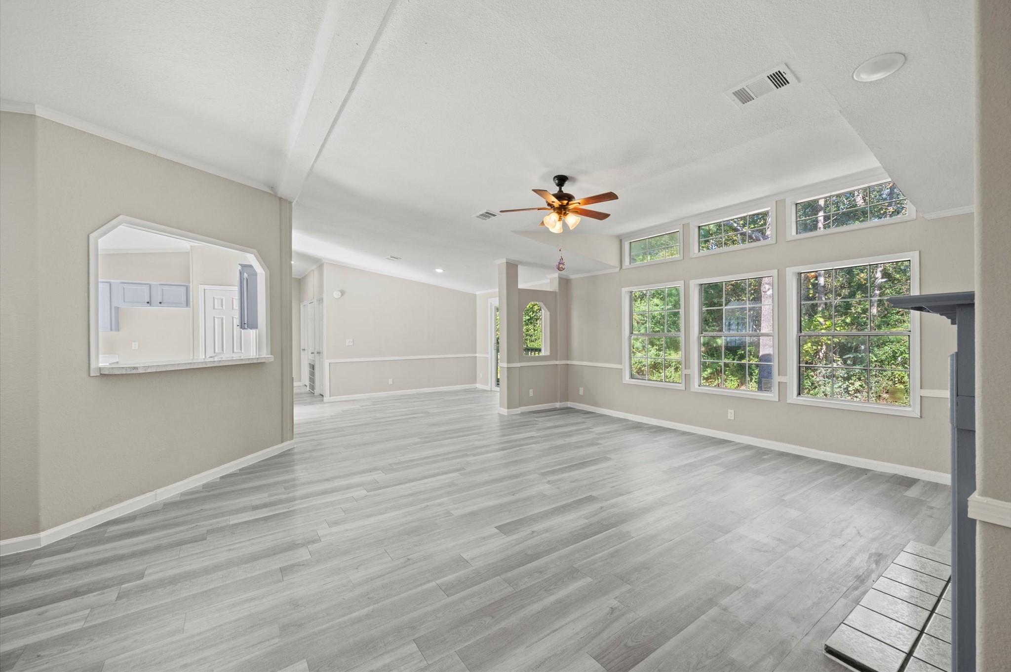 2701 Farm To Market 1127 Shepherd, TX 77371 - Photo 5 of 30 a view of an empty room with a window and wooden floor