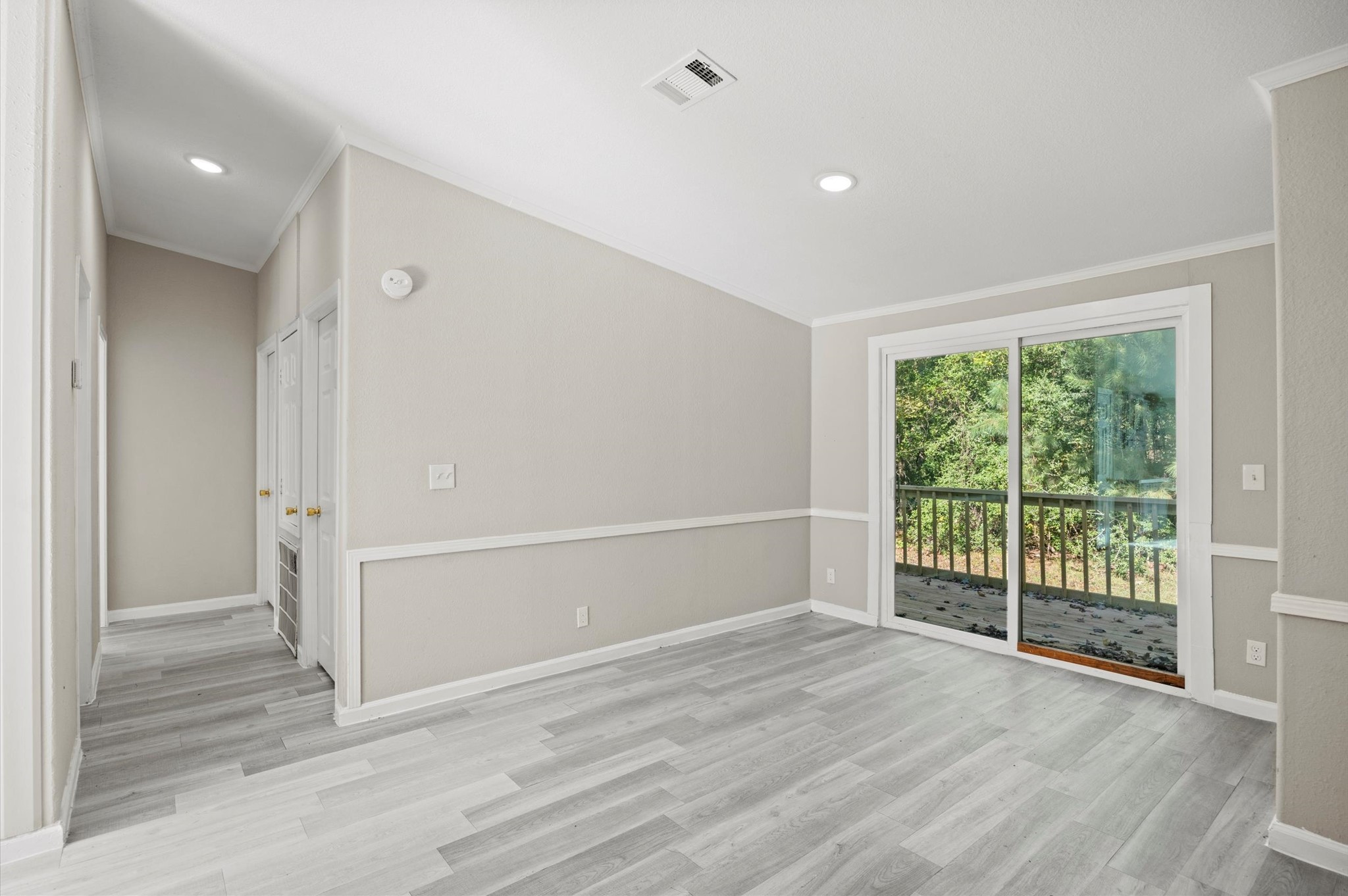 2701 Farm To Market 1127 Shepherd, TX 77371 - Photo 8 of 30 an empty room with wooden floor and windows