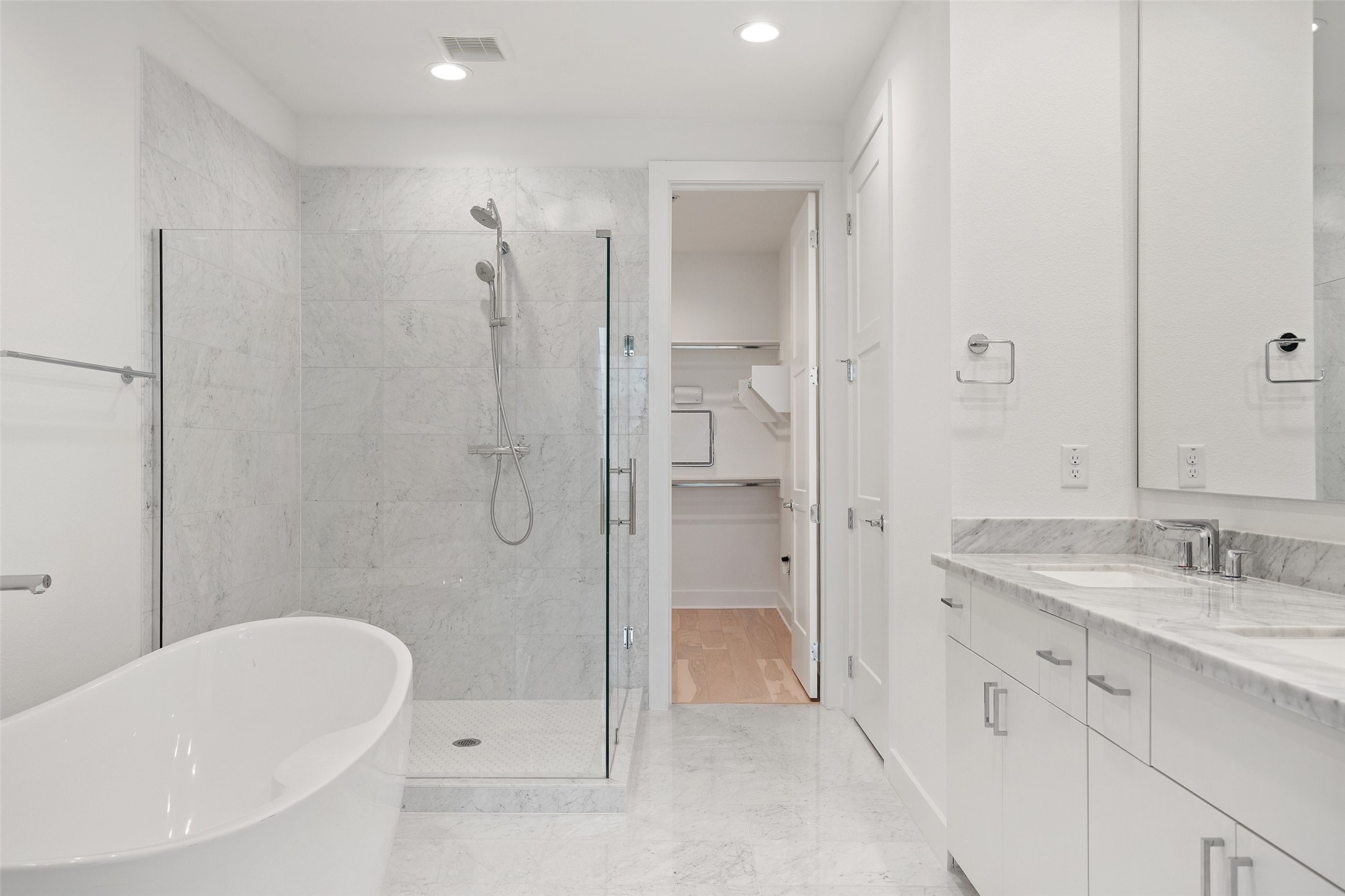 2805 McCurdy Street, Unit 6 Austin, TX 78723 - Photo 22 of 38 a bathroom with a granite countertop sink a mirror bathtub and shower