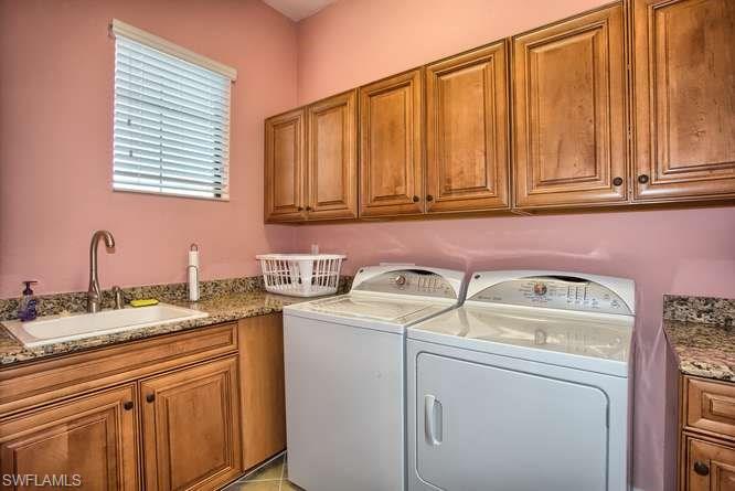 9633 Firenze Circle Naples, FL 34113 - Photo 15 of 25 a utility room with dryer and washer