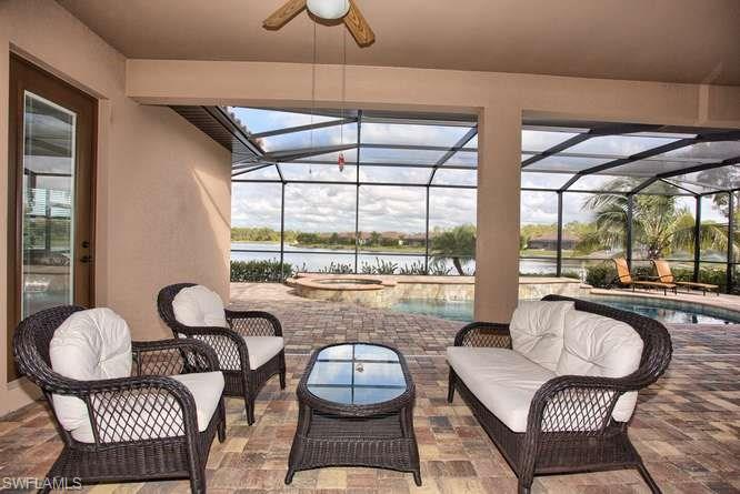 9633 Firenze Circle Naples, FL 34113 - Photo 20 of 25 a living room with furniture and a large window