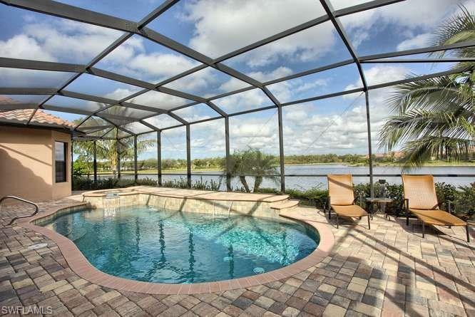 9633 Firenze Circle Naples, FL 34113 - Photo 22 of 25 a view of a swimming pool with a patio