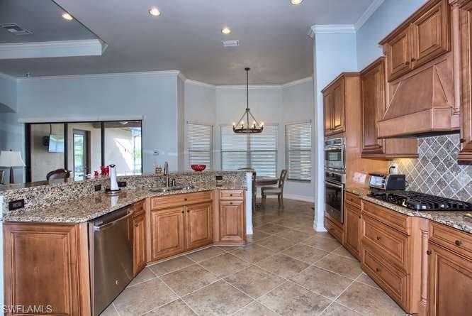9633 Firenze Circle Naples, FL 34113 - Photo 7 of 25 a kitchen with lots of counter top space
