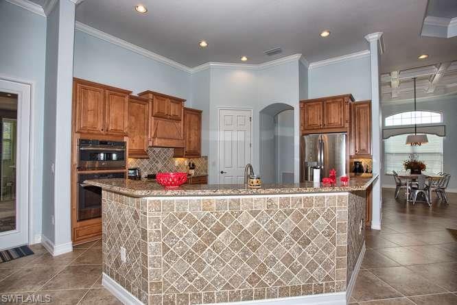 9633 Firenze Circle Naples, FL 34113 - Photo 8 of 25 a room with lots of gym equipment