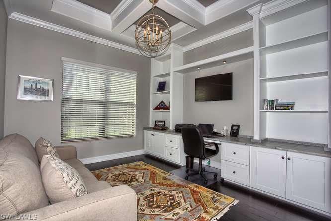 9633 Firenze Circle Naples, FL 34113 - Photo 10 of 25 a living room with furniture and a flat screen tv
