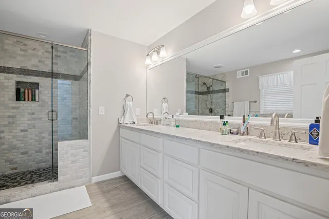 an empty room with wooden floor and window