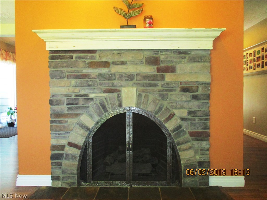 6803 Lake Road Madison, OH 44057 - Photo 13 of 25 Custom built gas fire place in the living room