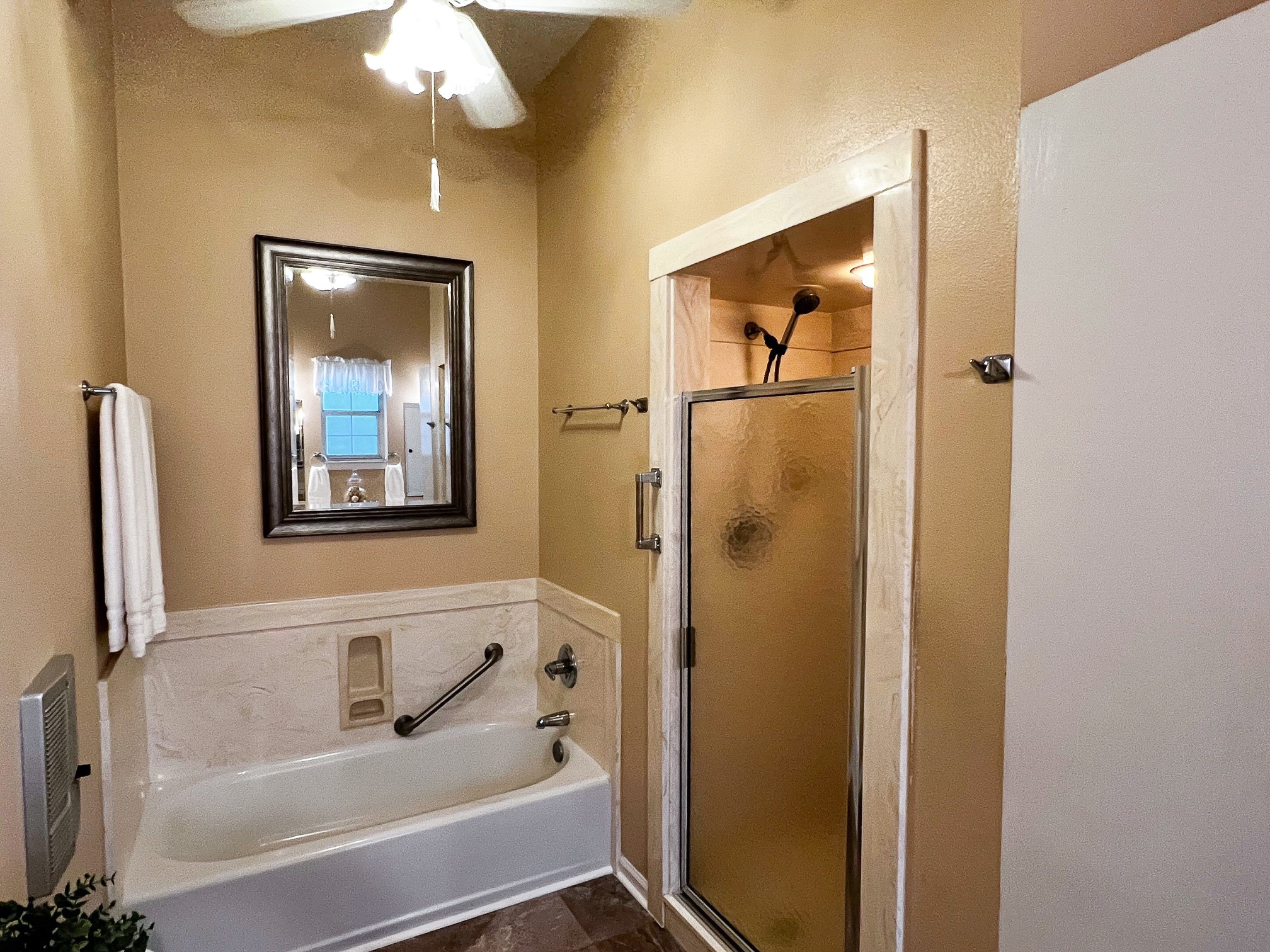 730 Panorama Road La Grange, TX 78945 - Photo 19 of 37 a bathroom with a bathtub and a shower