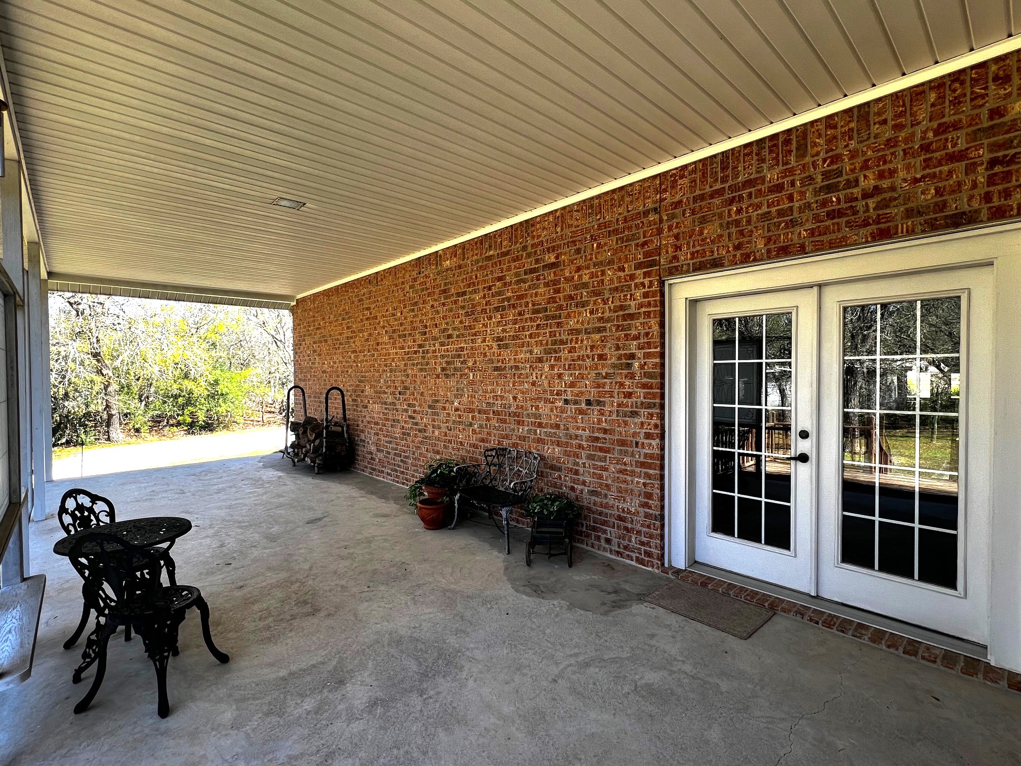 730 Panorama Road La Grange, TX 78945 - Photo 36 of 37 a backyard of a house with table and chairs