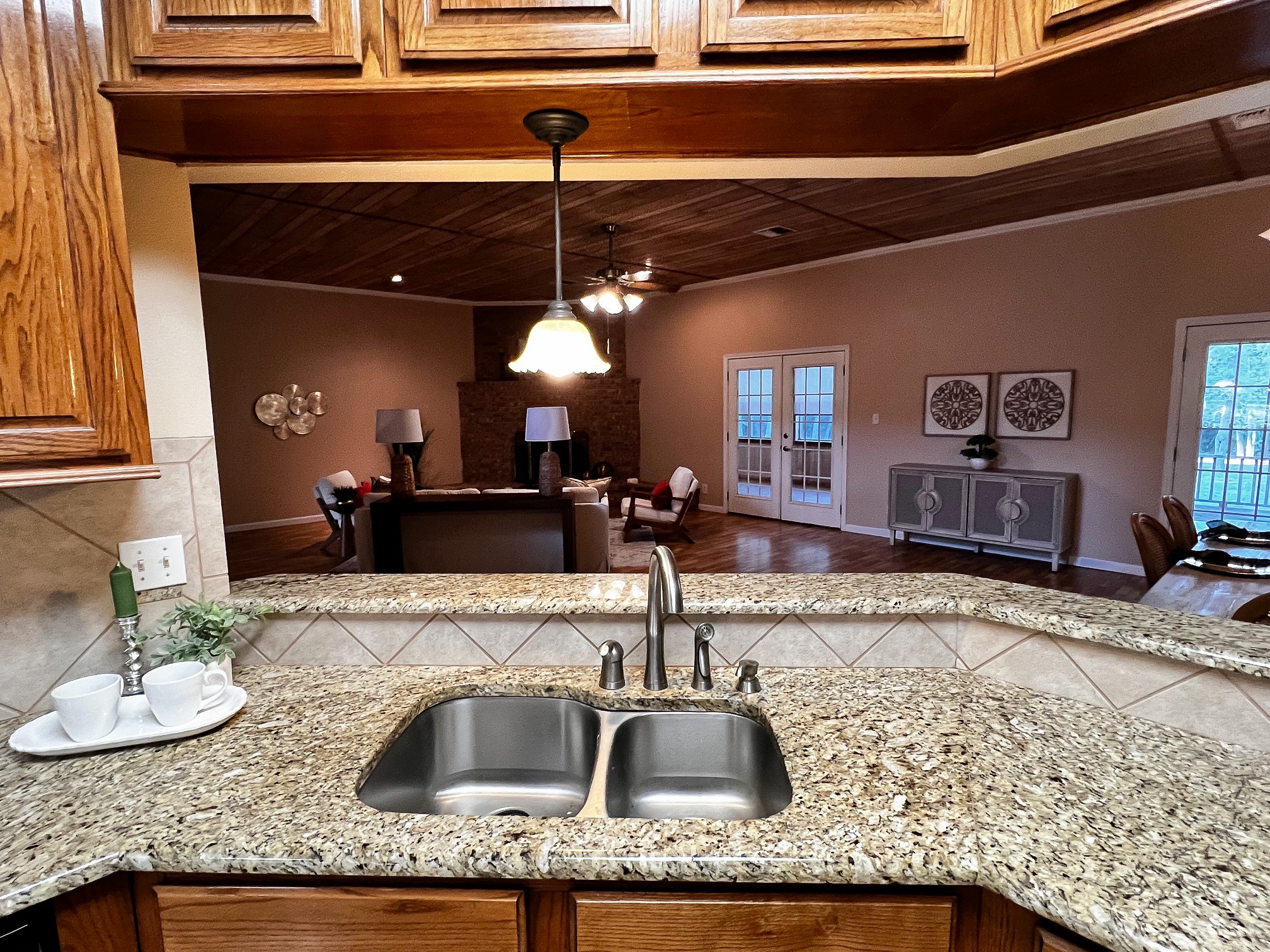 730 Panorama Road La Grange, TX 78945 - Photo 7 of 37 a kitchen with a granite countertop sink and natural light