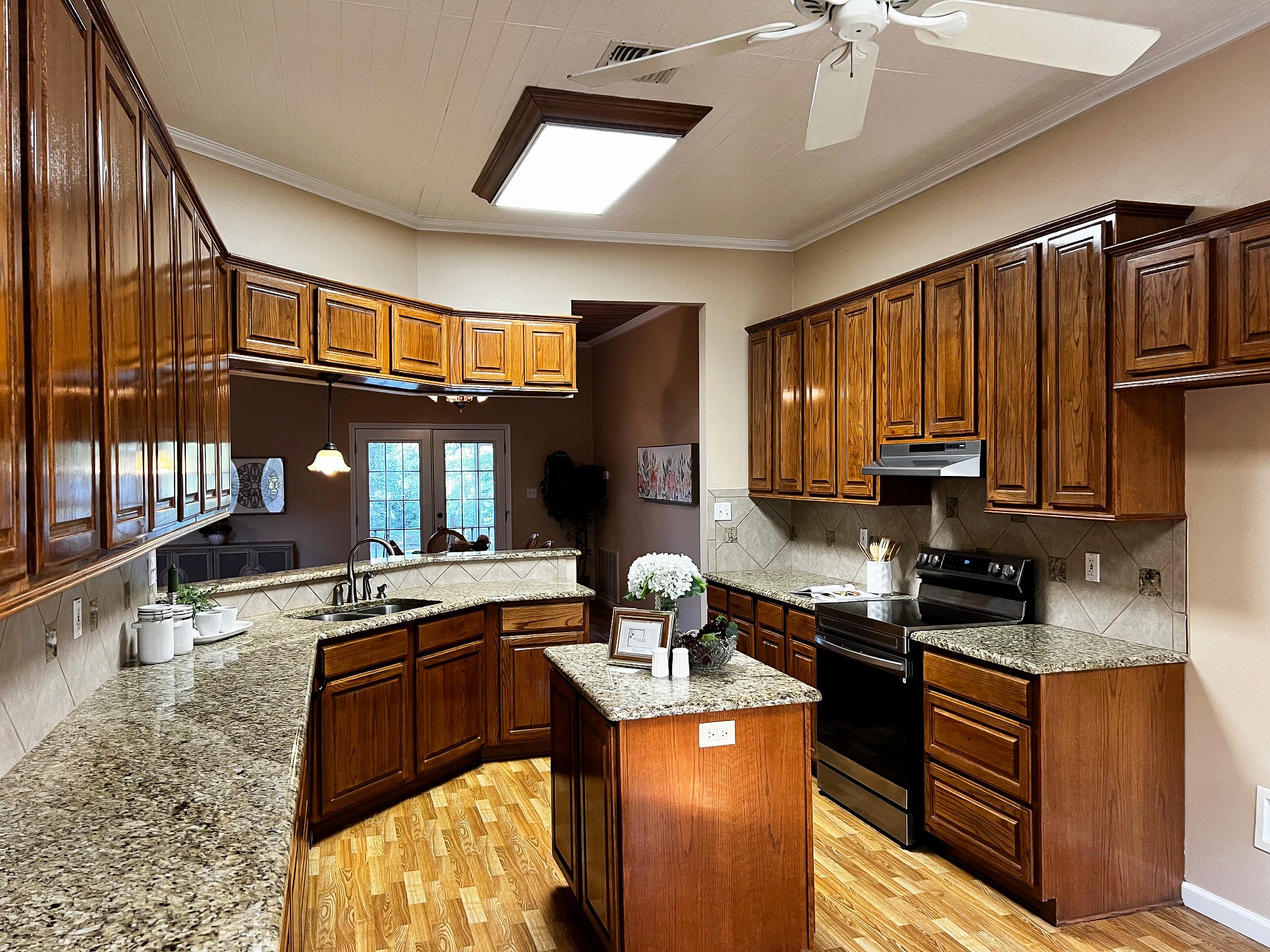 730 Panorama Road La Grange, TX 78945 - Photo 8 of 37 a kitchen with stainless steel appliances granite countertop a sink stove and refrigerator