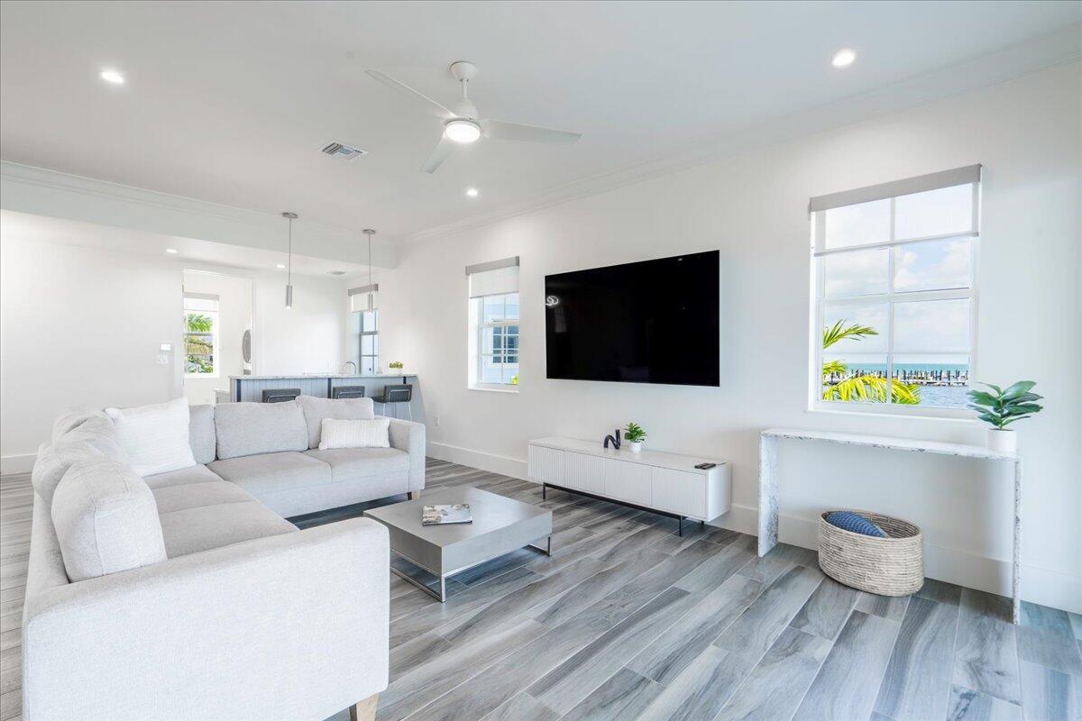 810 39th Street, Unit GULF Marathon, FL 33050 - Photo 12 of 113 a living room with furniture and a flat screen tv