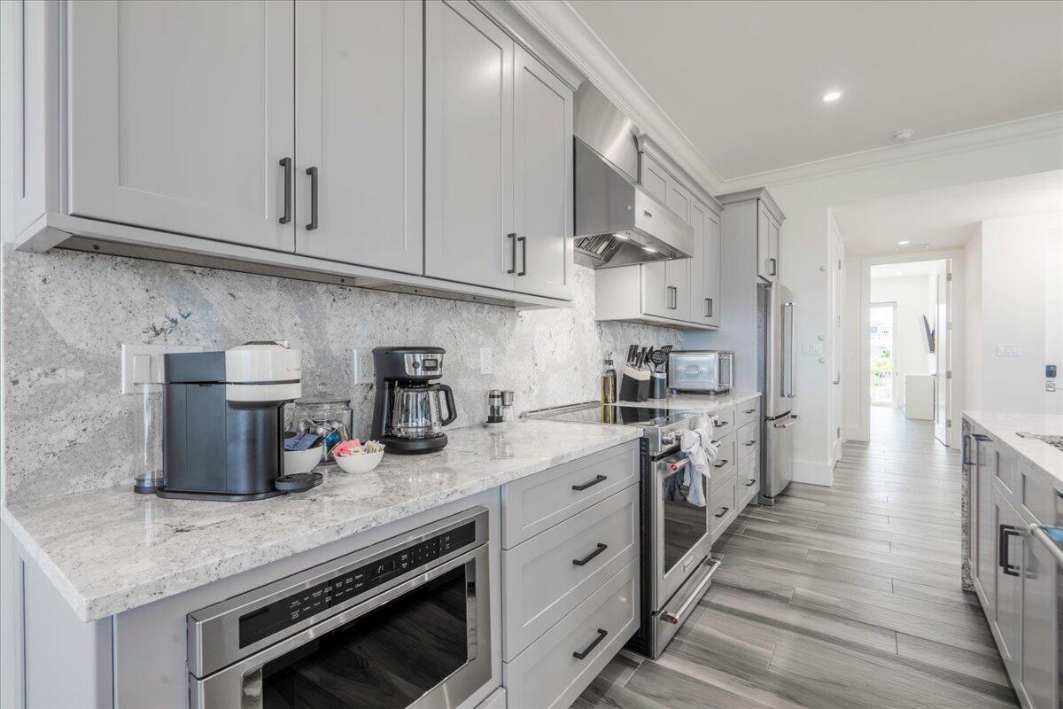810 39th Street, Unit GULF Marathon, FL 33050 - Photo 14 of 113 a kitchen with granite countertop white cabinets and stainless steel appliances